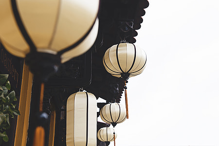 selective photography of beige hanging lantern thumbnail