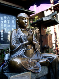 selective focus photograph Gautama Buddha statuette thumbnail