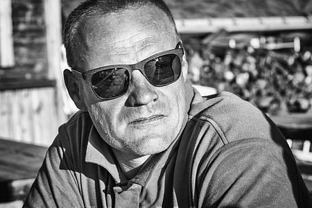 grayscale photography of man wearing sunglasses and polo shirt at daytime thumbnail