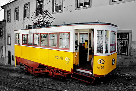 selective color photography yellow and black Carris tram thumbnail