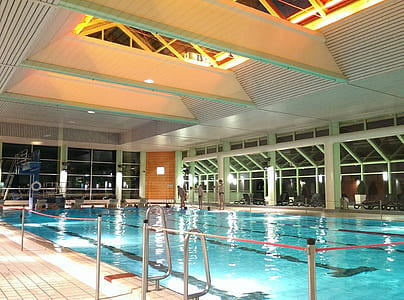 people standing on indoor swimming pool thumbnail