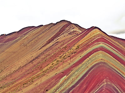 red, green, and yellow mountain under sky thumbnail