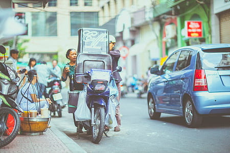 man and woman standing behinde motorcycle thumbnail