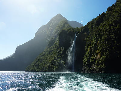 landscape photography of mountain surrounded by body of water thumbnail