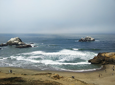 group of people at the coastline near body of water thumbnail