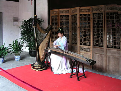 woman playing string instrument thumbnail