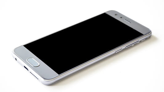 turned off smartphone on white surface thumbnail