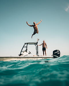 man dive on body of water thumbnail