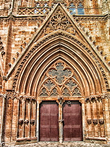 closed brown doors of brown building thumbnail