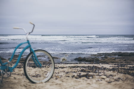 blue cruiser bicycle on seashore thumbnail