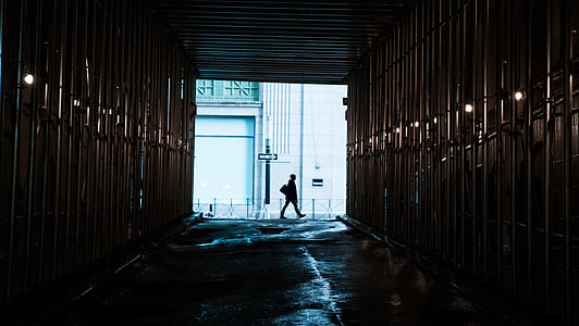 person walking in middle of tunnel thumbnail