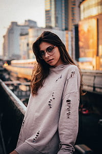 woman wearing gray long-sleeved distressed shirt thumbnail