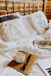 Morning coffee in bed. Working in bed thumbnail