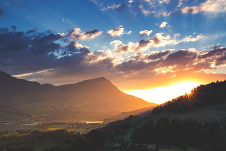 silhouette of mountain during sunrise thumbnail