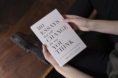 person holding 101 Essays That Will Change The Way You Think thumbnail