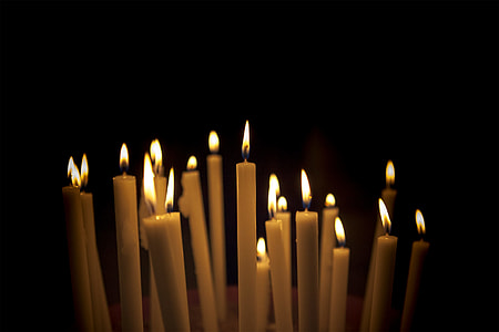 lighted white candles thumbnail