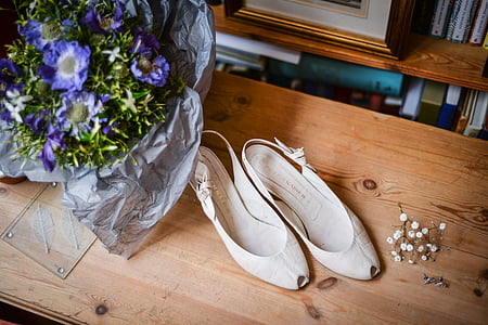 pair of white slink back flat shoes bey the purple flower bouquet thumbnail