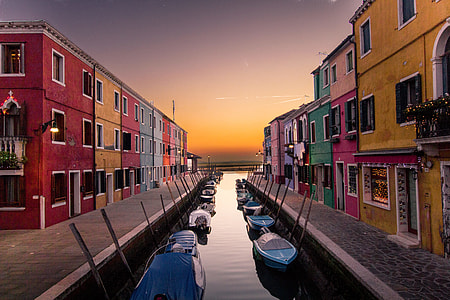assorted-color boats on calm body of water thumbnail