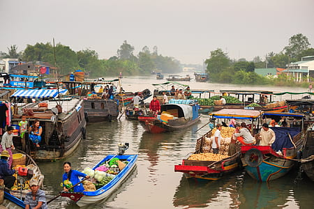 group of people inside boats during daytime thumbnail