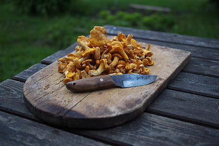 mushroom on brown wooden chopping board thumbnail