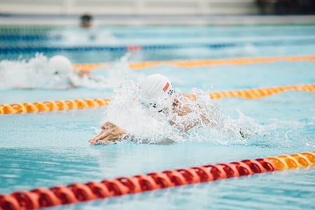 close-up photo of swimmers competing at daytime thumbnail