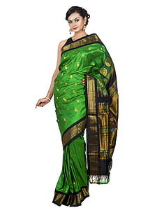 woman wearing green and black dress standing thumbnail