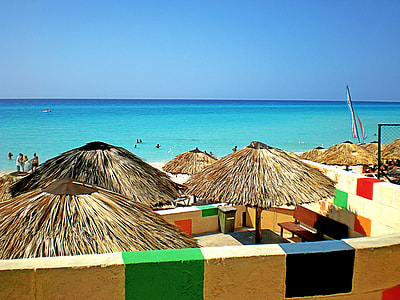 brown nipahuts on beach thumbnail