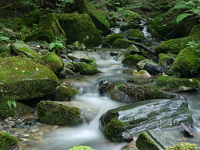 waterfalls surrounded by rocks thumbnail