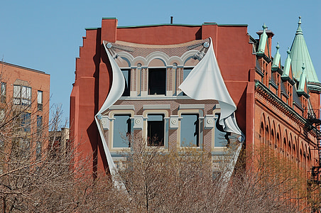 landscape photography of brown and teal building thumbnail
