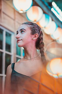 woman standing near window thumbnail