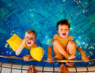 two toddler's on pool smiling thumbnail
