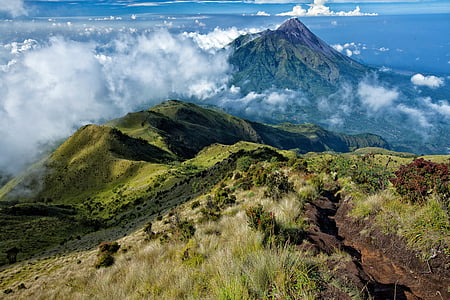 long exposure photography of mountain and clouds thumbnail