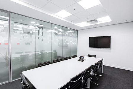 conference room with black flat screen TV mounted on the wall thumbnail