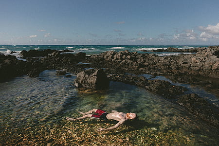 man floating on body of water thumbnail