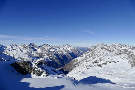 snow covered mountain under clear blue sky thumbnail