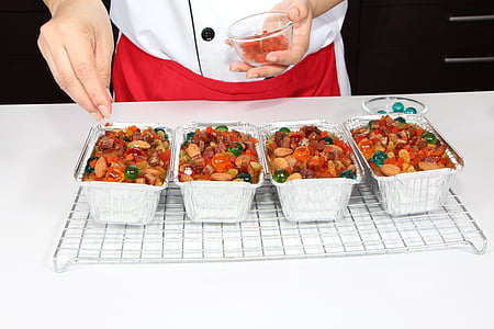 man pouring spice on gray tray thumbnail