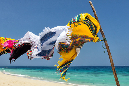 assorted-color clothes hanging on wire thumbnail