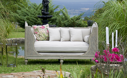 gray couch in green grass field during day time thumbnail
