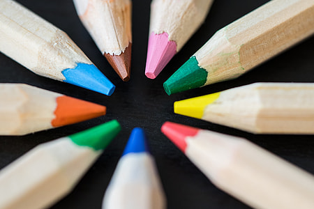 Colored Pencils in a Circle on a Black Desk thumbnail