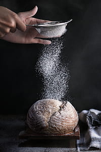 person pouring powder on bread thumbnail