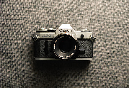 black and silver Canon RT-1 SLR camera thumbnail