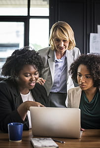 Three Women in Front of Laptop Computer thumbnail