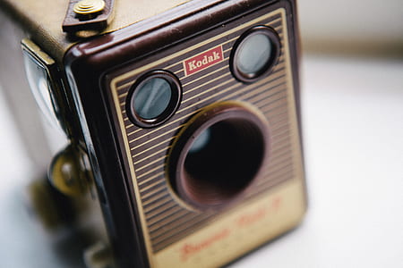 selective focus photography brown, white, and black Kodak land camera thumbnail