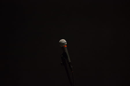 microphone on stand in dark room thumbnail