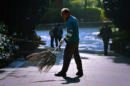 man cleaning street thumbnail