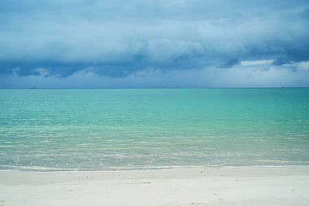 green body of water and white clouds during daytime thumbnail