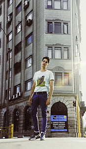 man standing near the building thumbnail