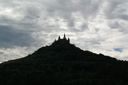 silhouette photo of mountain under gray sky thumbnail