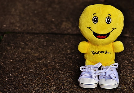 selective focus of yellow emoji plush toy thumbnail