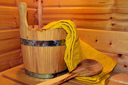 brown wooden ladle beside bucket thumbnail